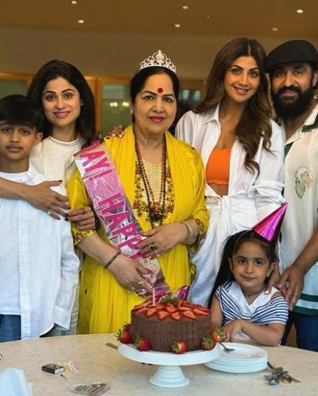 Bollywood actress Shilpa Shetty smiling alongside her mother Sunanda Shetty at a family gathering.