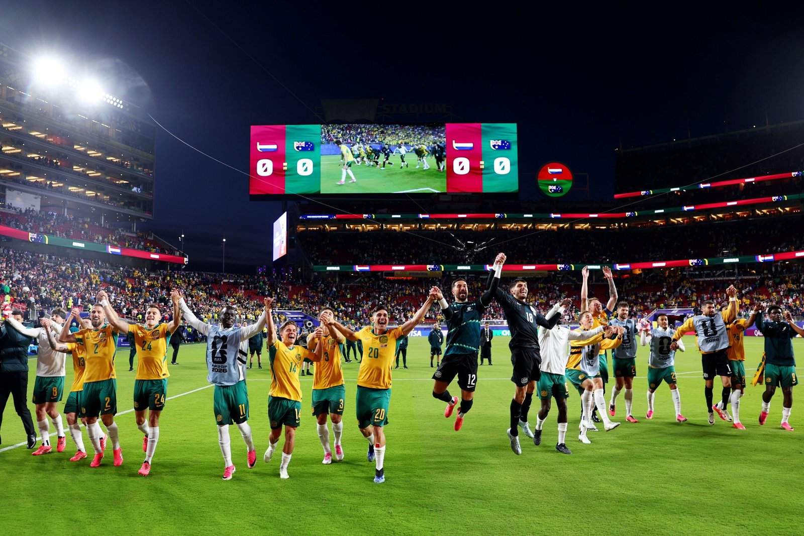 Australia and Paraguay players compete for possession during their FIFA World Cup 2026 Group D match, which ended in a goalless draw and secured Australia's place in the Round of 32.