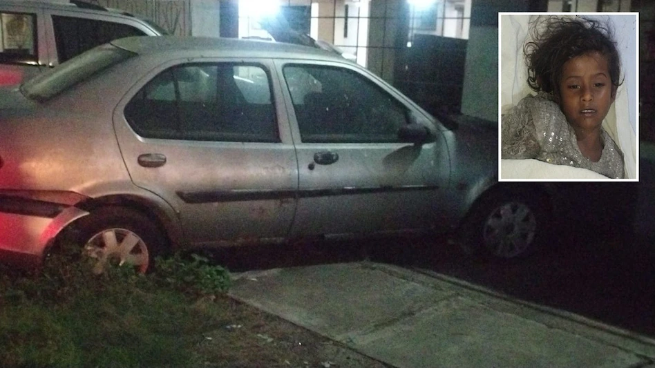 A parked abandoned car outside a residential compound in Chaibasa Jharkhand where a tragic asphyxiation incident occurred.