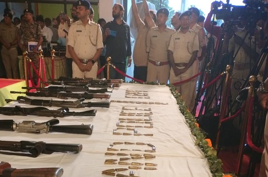 Sixteen surrendered CPI Maoists presenting laid down INSAS and AK-47 rifles before Jharkhand Police in Ranchi