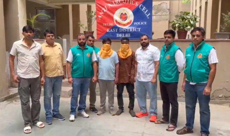 Delhi Police officers display seized narcotics, mobile phones and scooters after busting an alleged MDMA supply network in East Delhi.