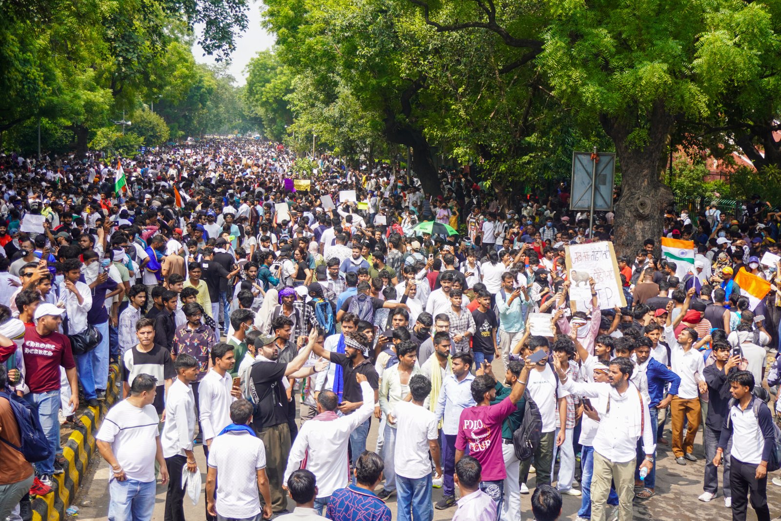 CJP founder Abhijeet Dipke and student protesters celebrating at Jantar Mantar following Union Education Minister Dharmendra Pradhan's resignation.