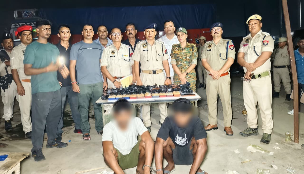 Guwahati Police officials display seized soap cases of heroin and packets of YABA tablets following an operation near ISBT.