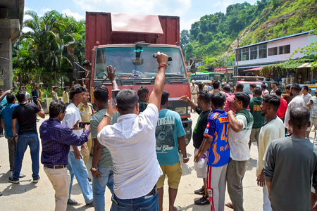 Commercial taxis lined up along the interstate border between Meghalaya and Assam amid travel suspension and security concerns