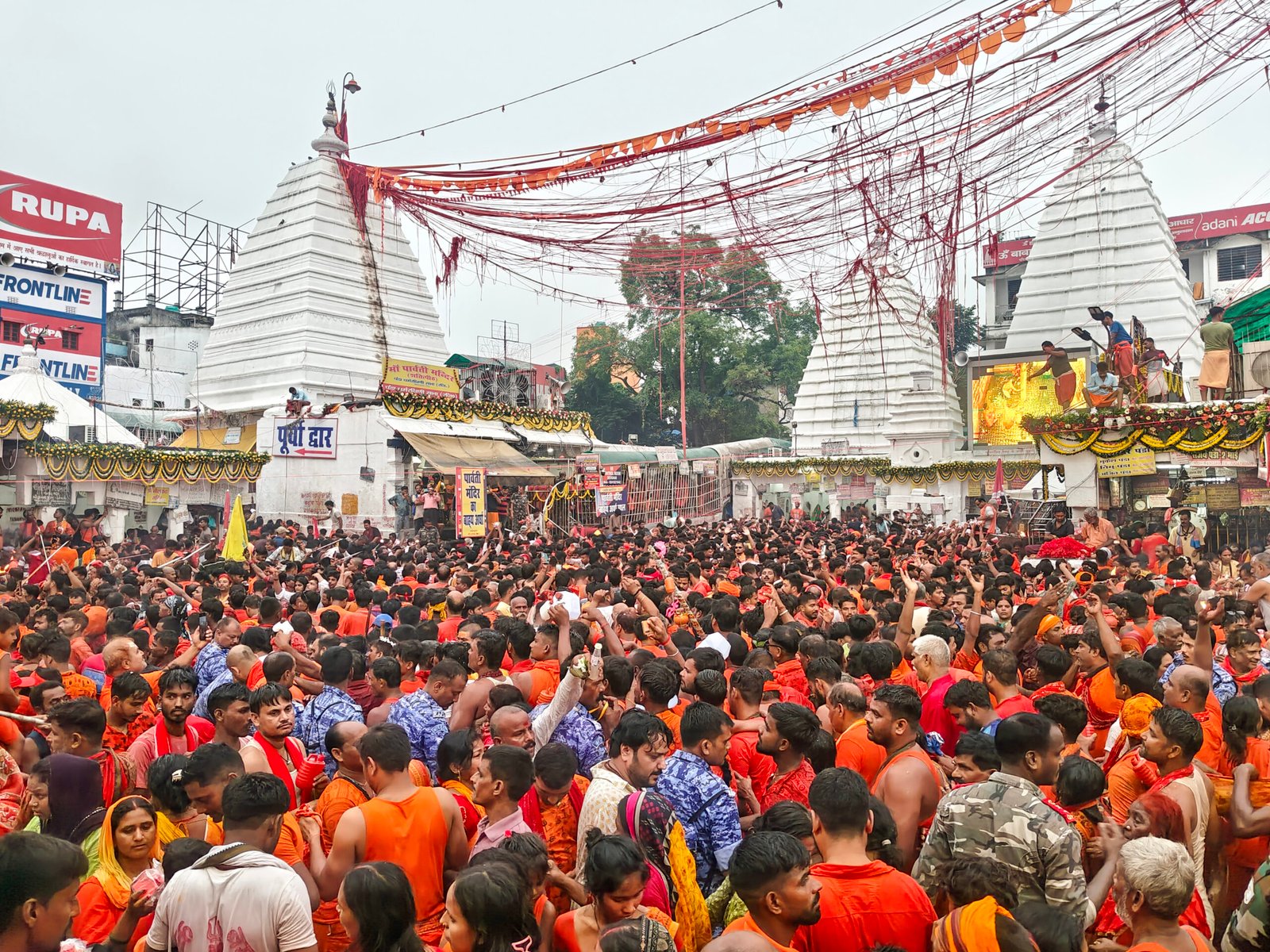 Devotees queuing for Jalabhishek at Baba Baidyanath Temple in Deoghar on second Monday of Shravan.