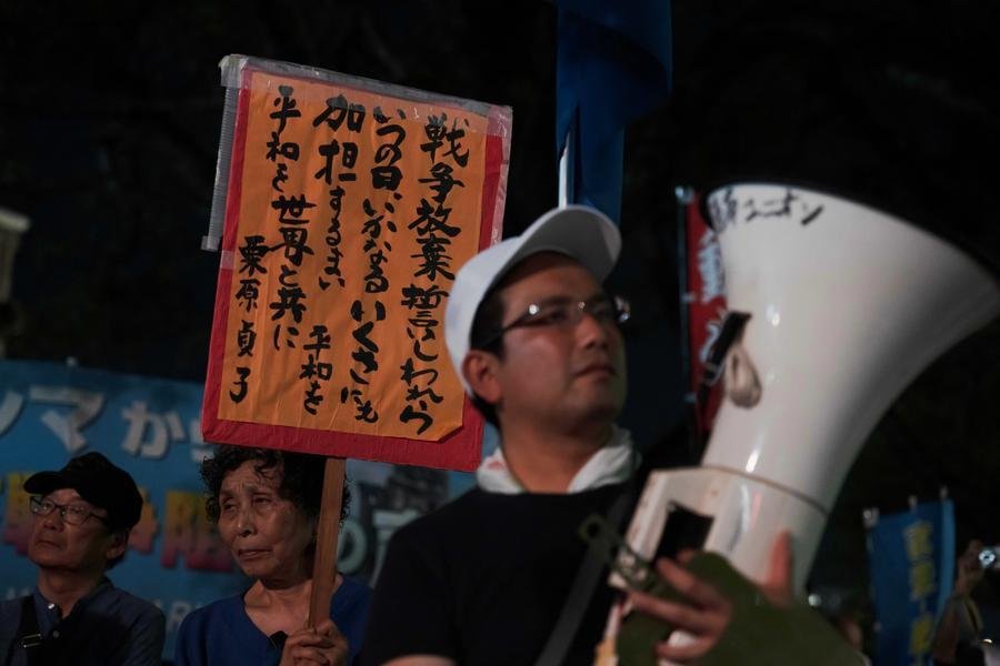 Peace Memorial Park in Hiroshima during the annual atomic bombing anniversary ceremony with thousands observing silence