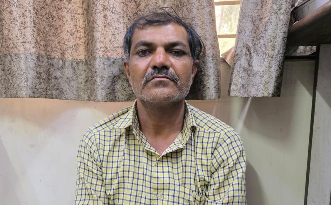 Rajkot police team leading accused auto driver Ramesh Vaidhukiya in connection with the rape and murder of a 76-year-old woman.