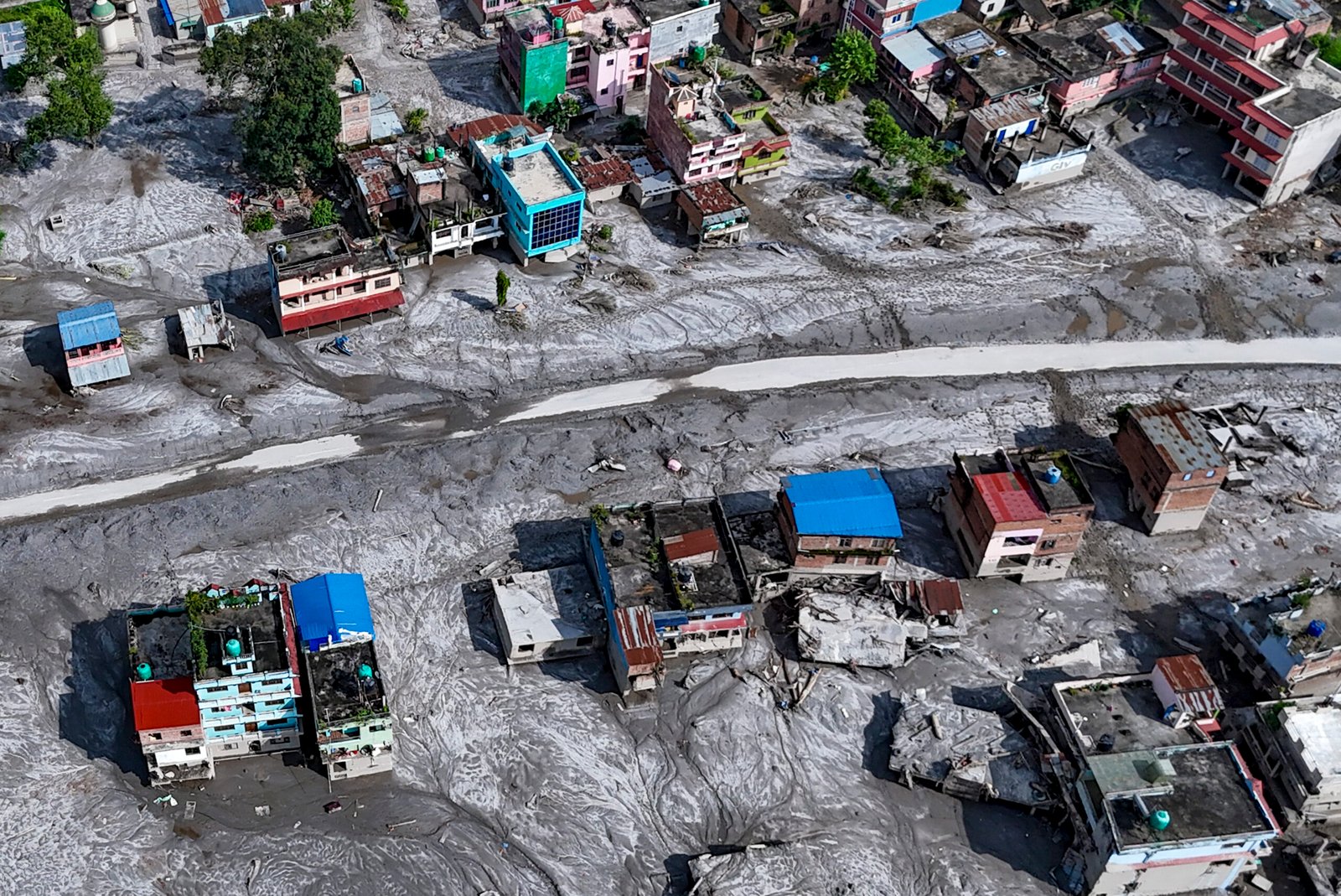 Rescue personnel conducting search and relief operations in flood-hit central Nepal following devastating flash floods.