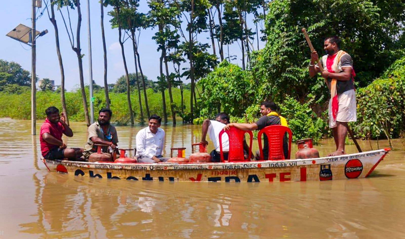 rescue teams navigating inundated village during bihar floods