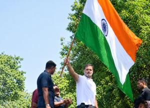 LoP Rahul Gandhi Waves National Flag as INDIA Bloc Demands CEC’s Resignation