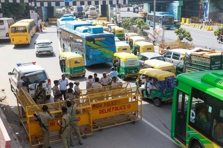 Robbers barged into an office in Delhi's Lahori Gate area, looting Rs 2.30 crore at gunpoint in broad daylight. Delhi Police launch manhunt.